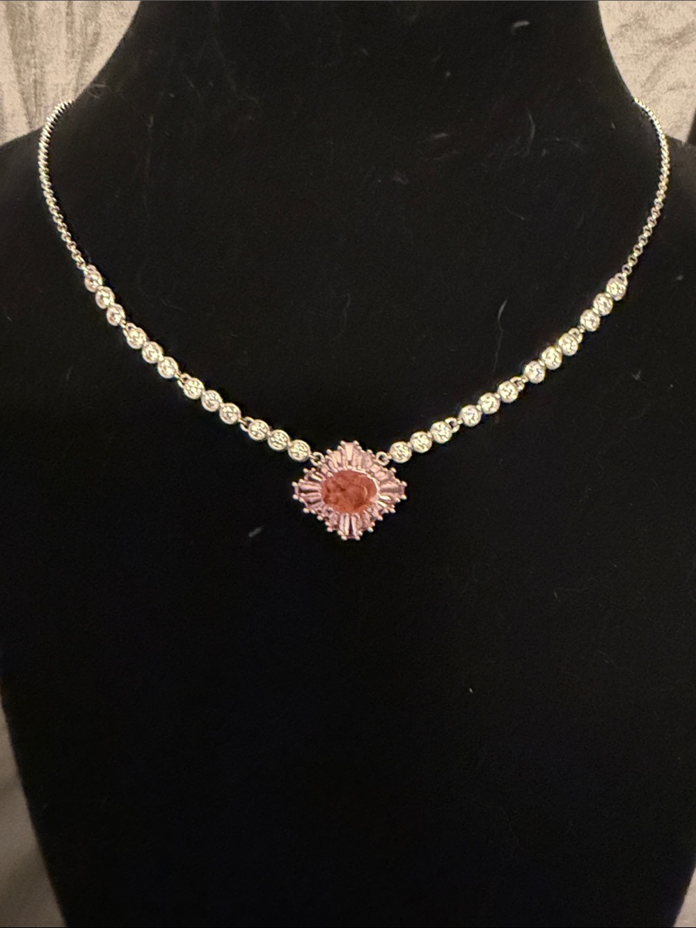 Sparkling Silver Tennis Necklace with Pink Sunburst Pendant